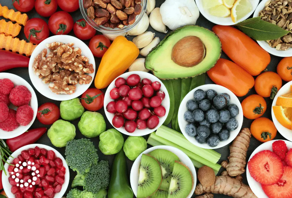 Overhead view of a table of vibrant fruits and vegetables